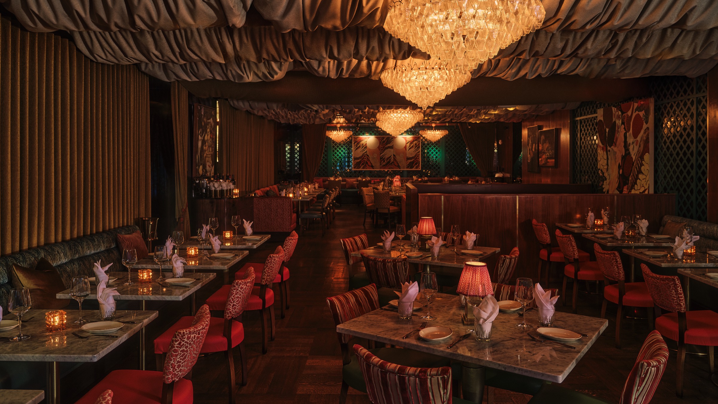 Sirrah's candlelit Meatpacking dining room with banquettes